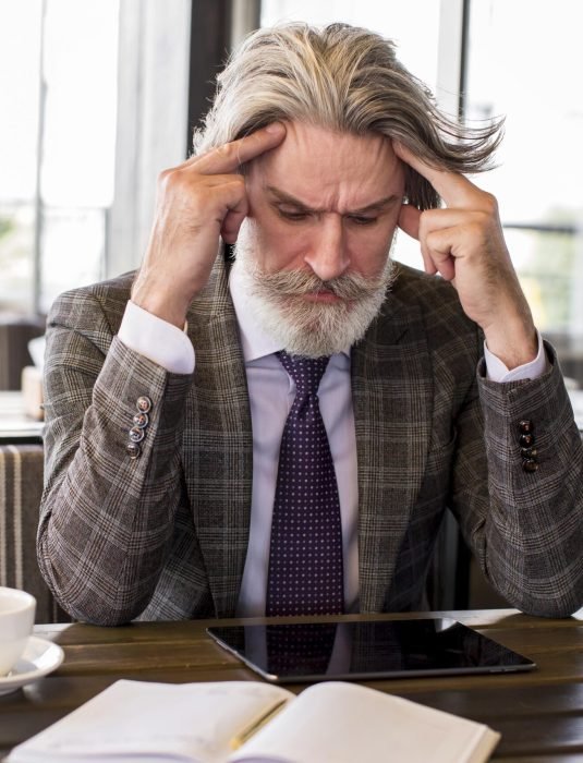 portrait-elegant-mature-male-thinking-office